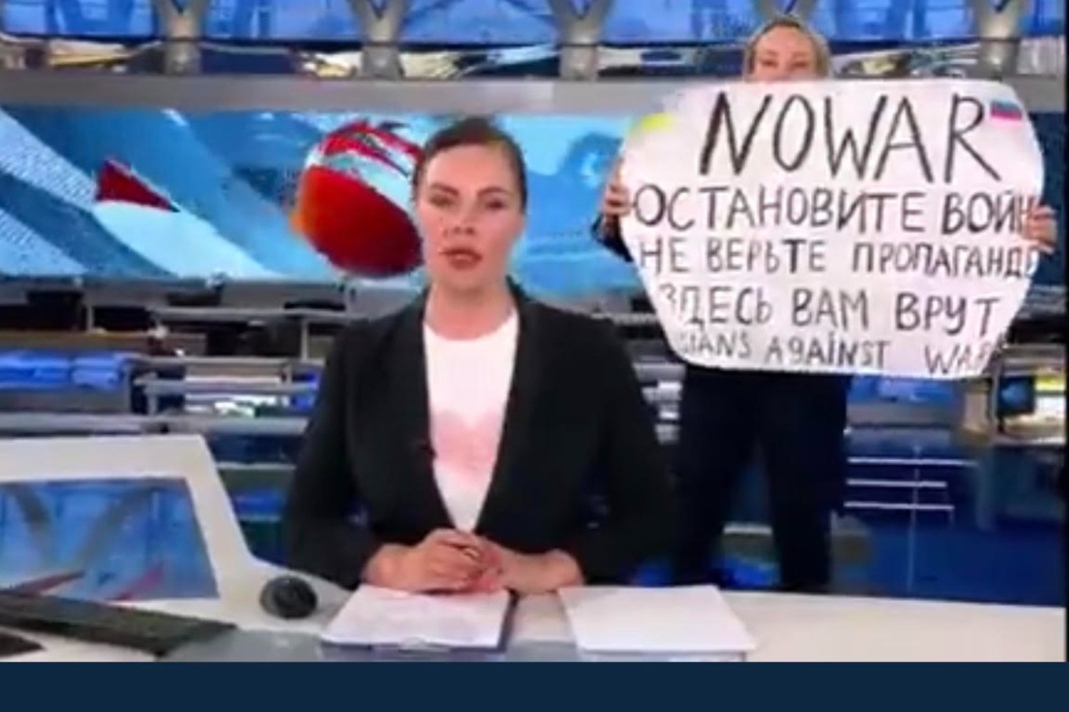 Anti war activist interrupts live Russian state TV news show