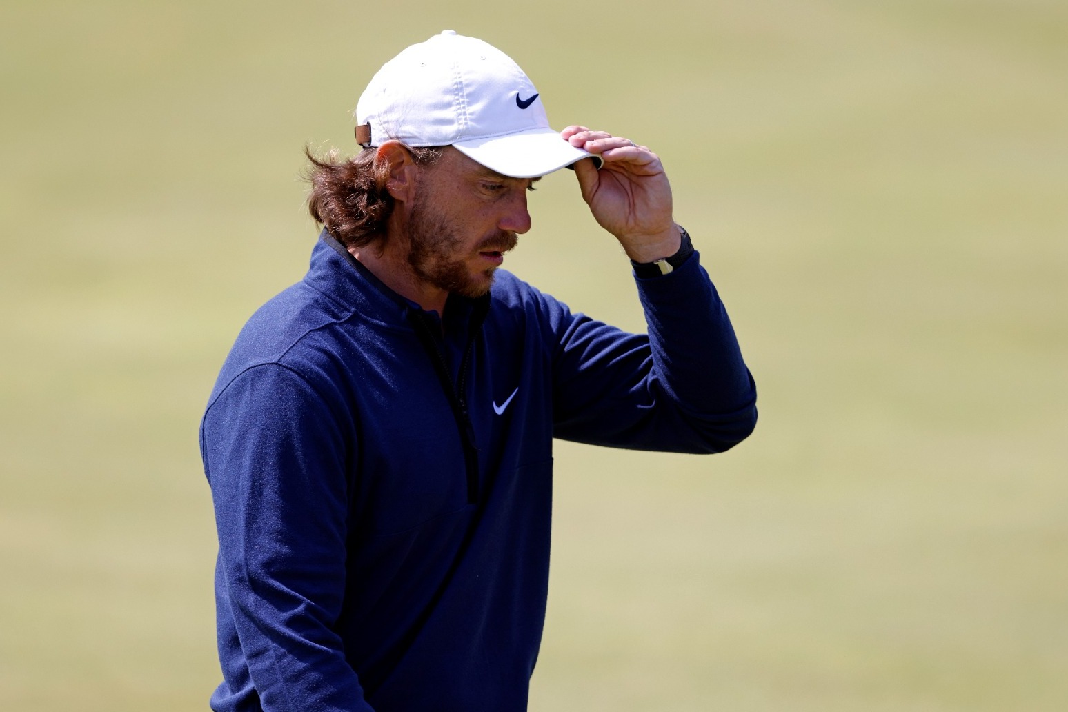 Early starters battle overcast conditions as Tommy Fleetwood shares Open lead 
