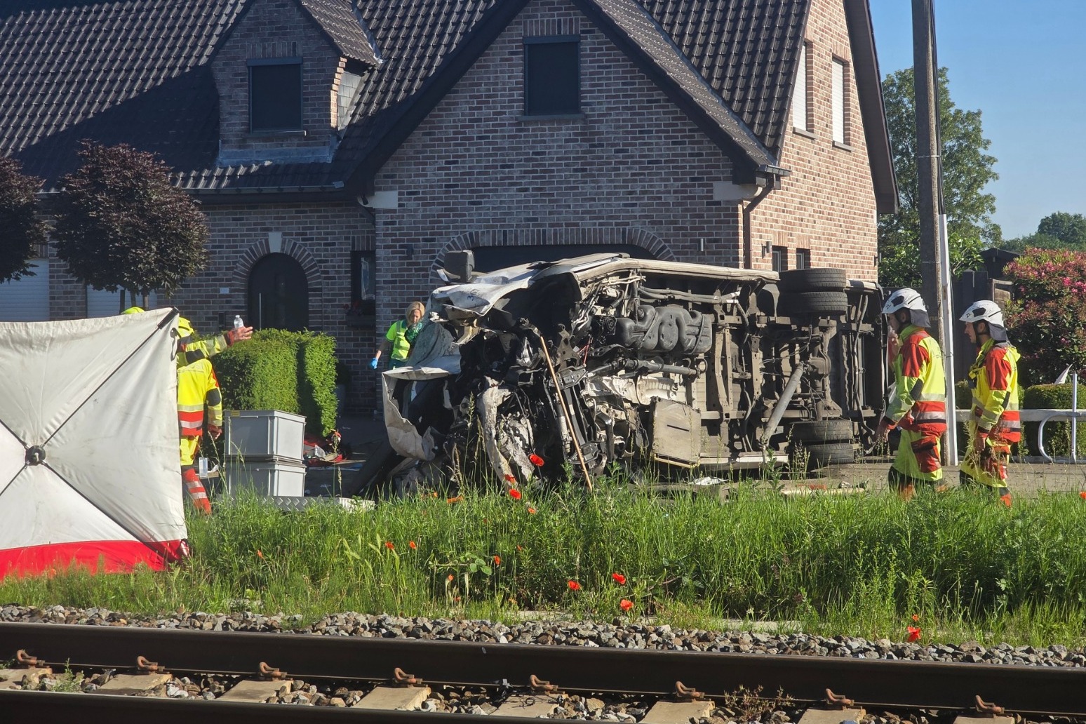 Several hurt in crash between train and minibus carrying children in Belgium
