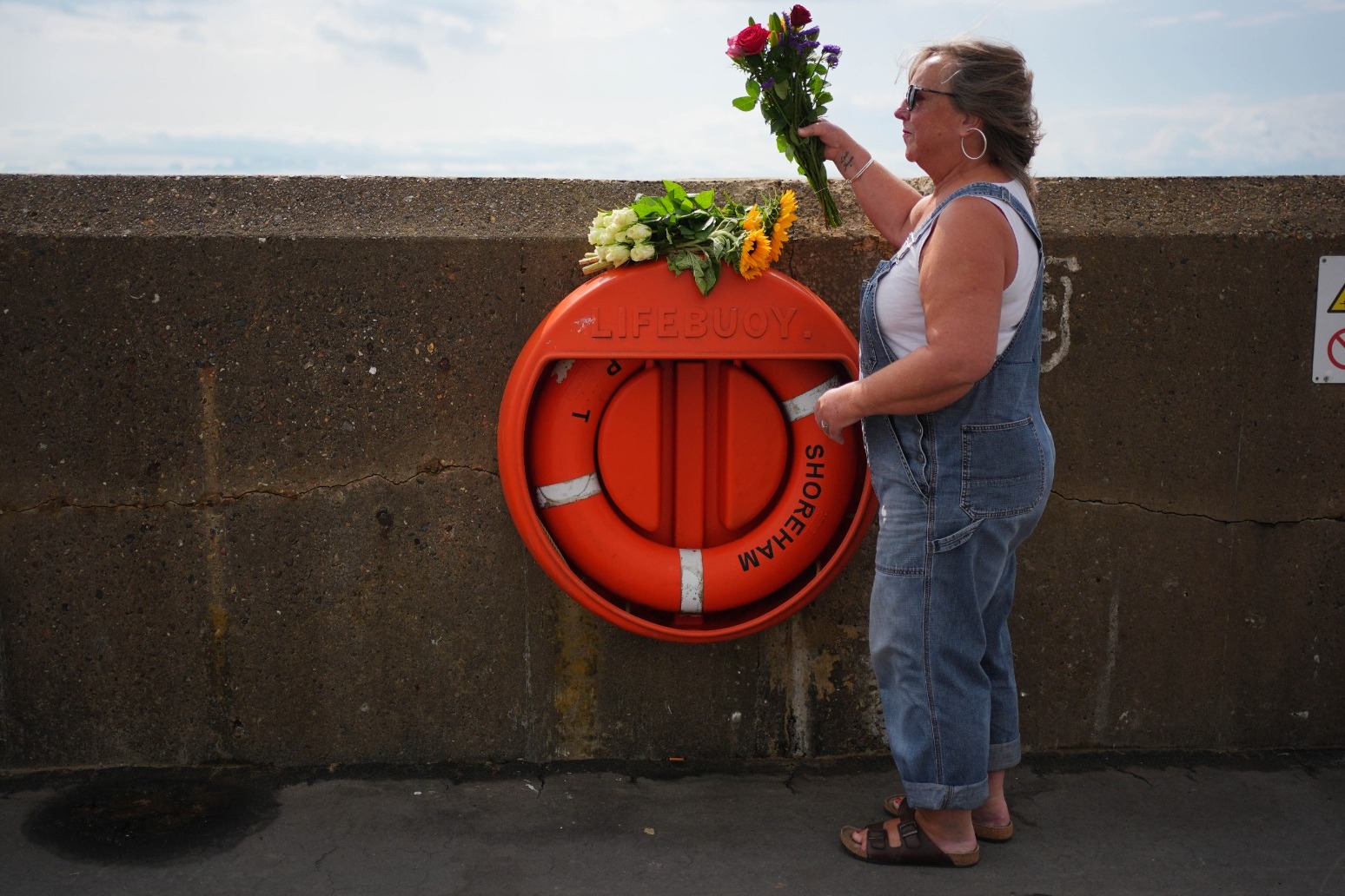 Father, mother and daughter who died after entering water off Sussex named