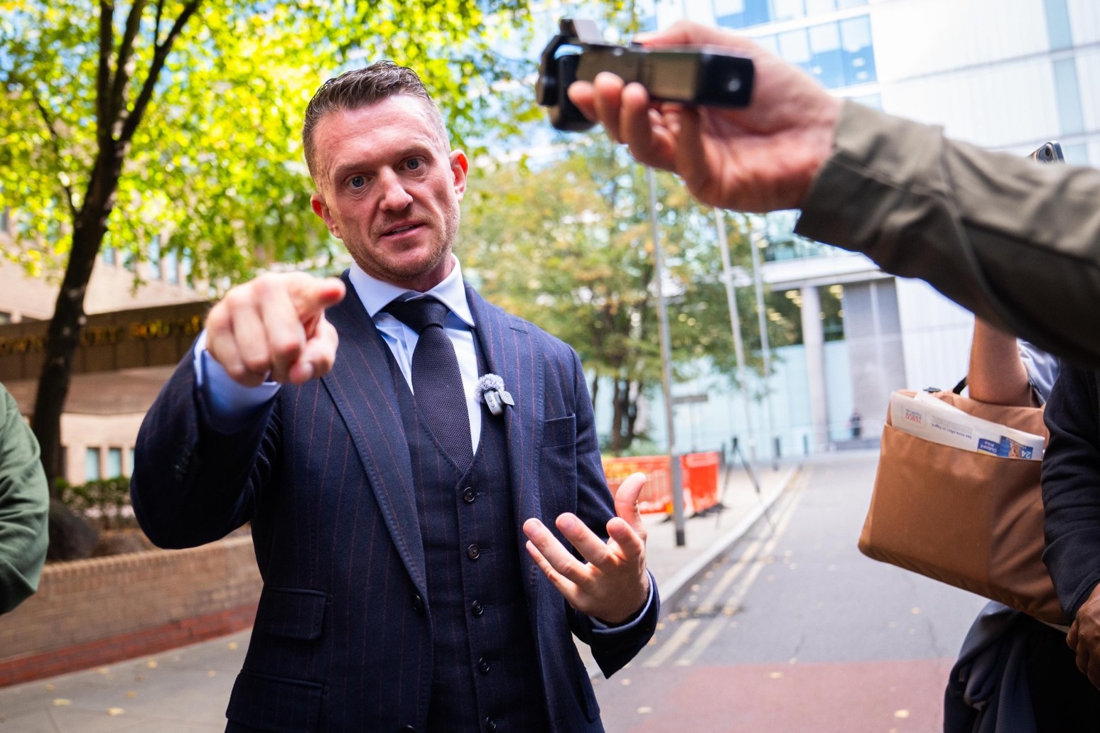 Tommy Robinson to go on trial over alleged harassment of two journalists