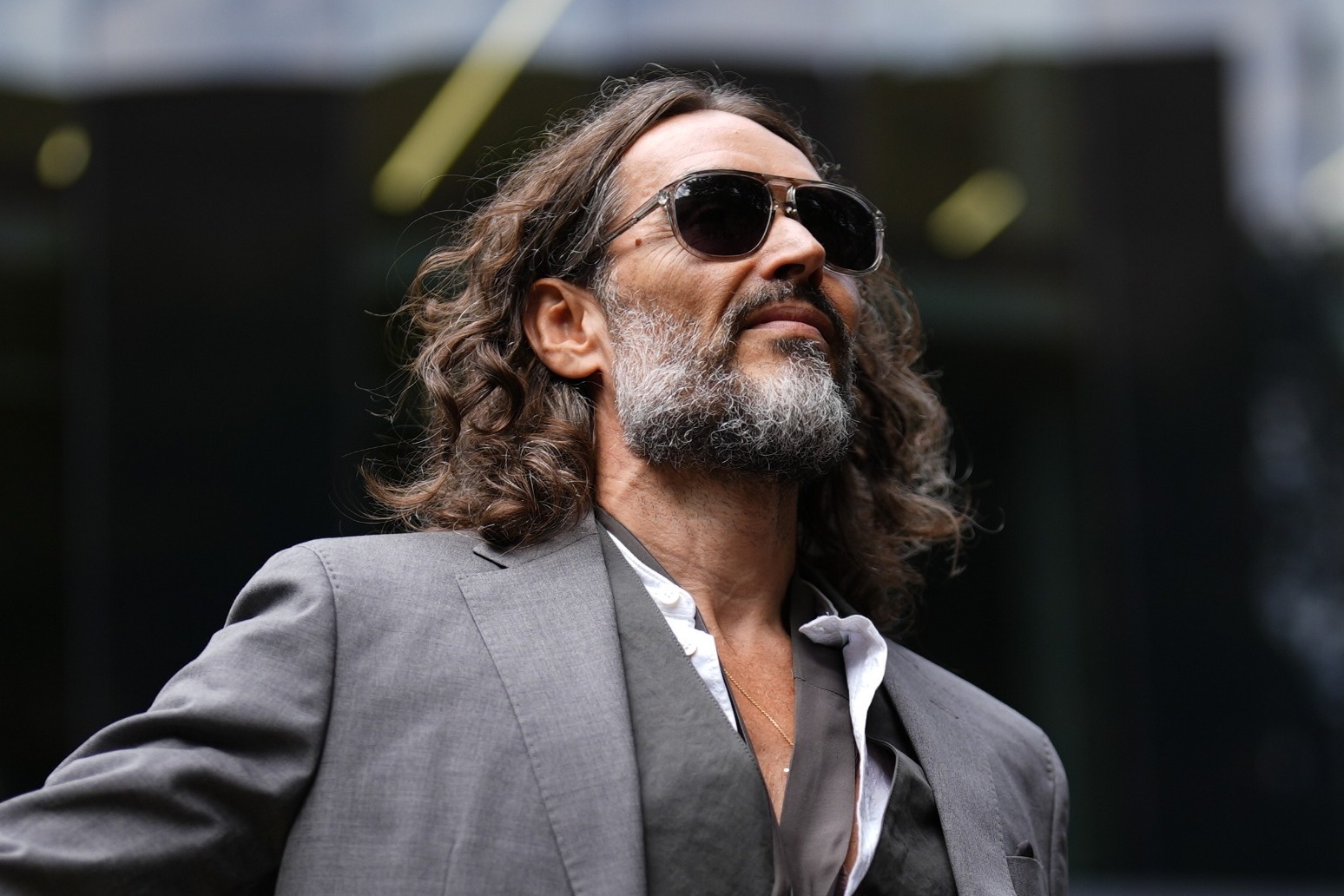 Russell Brand arrives at court for hearing ahead of rape trial