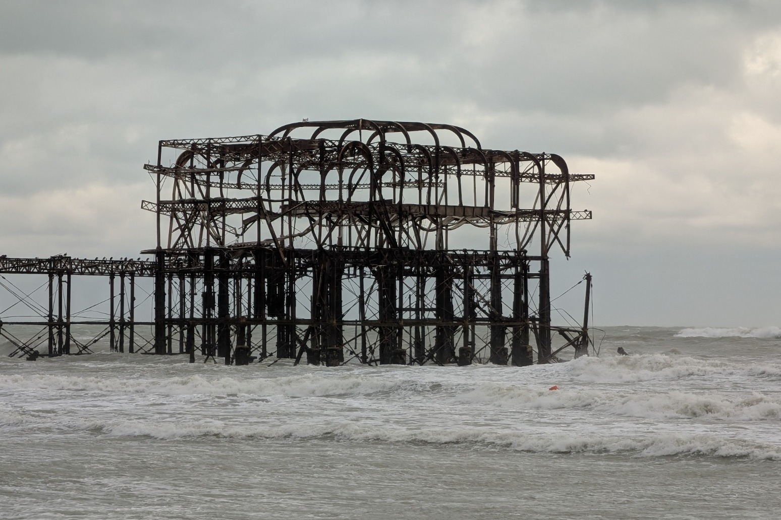 Part of historic Brighton pier collapses as storms bring heavy disruption