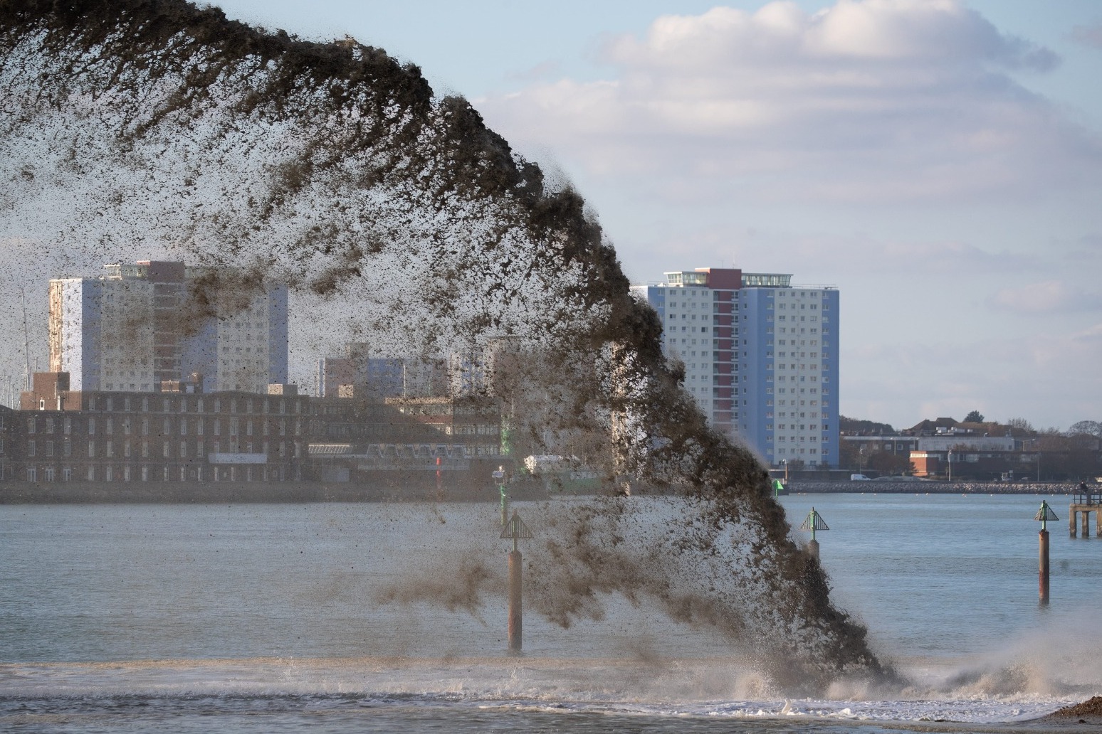 Dredger sprays tonnes of gravel on to Portsmouth foreshore for sea defence work 