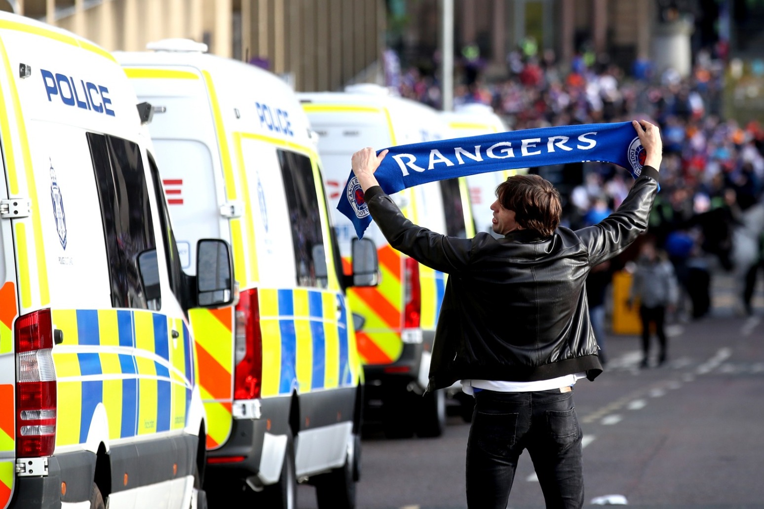 Three police injured and 20 arrested as Rangers fans celebrate in Glasgow 