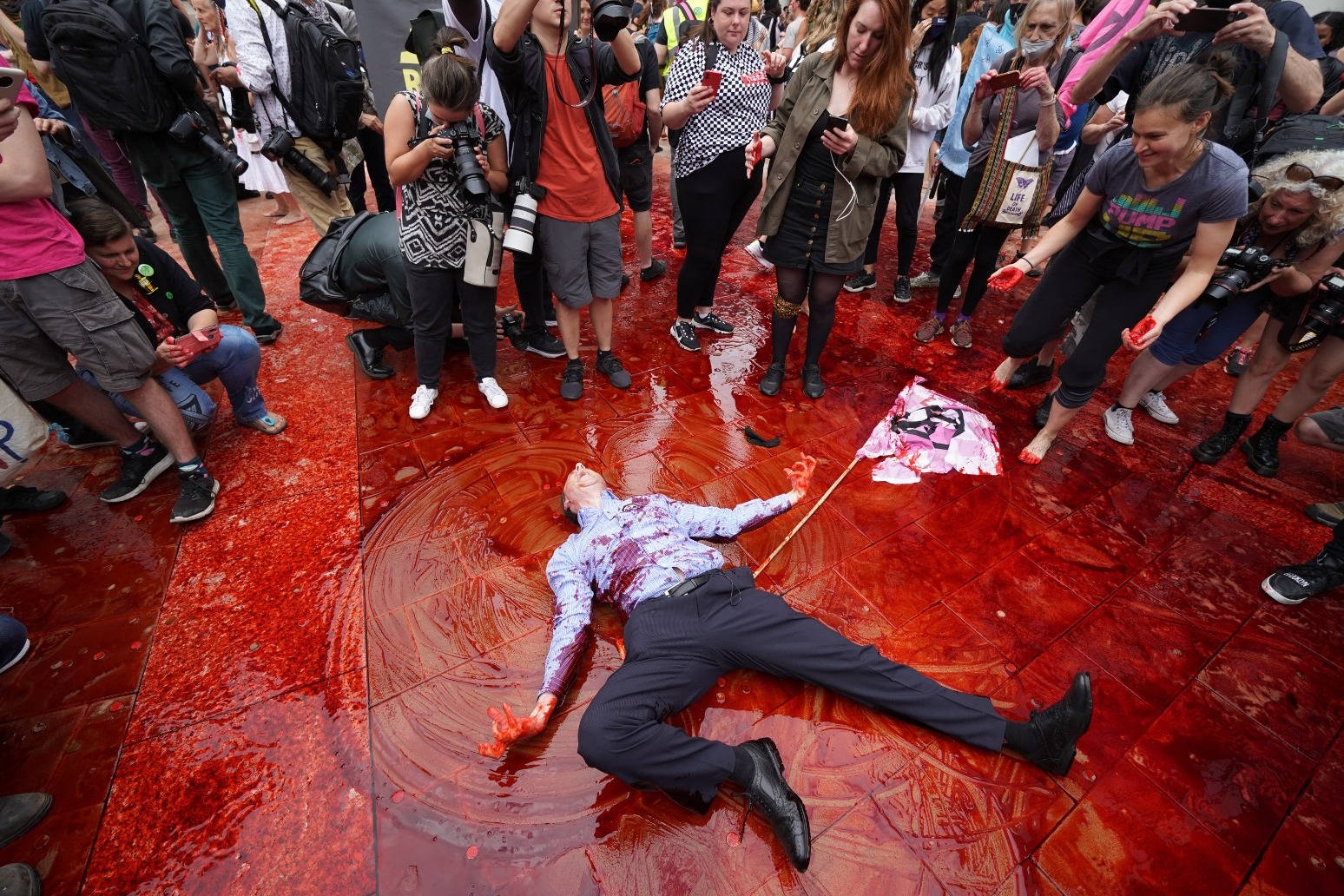 Climate protesters throw red paint over London’s Guildhall 