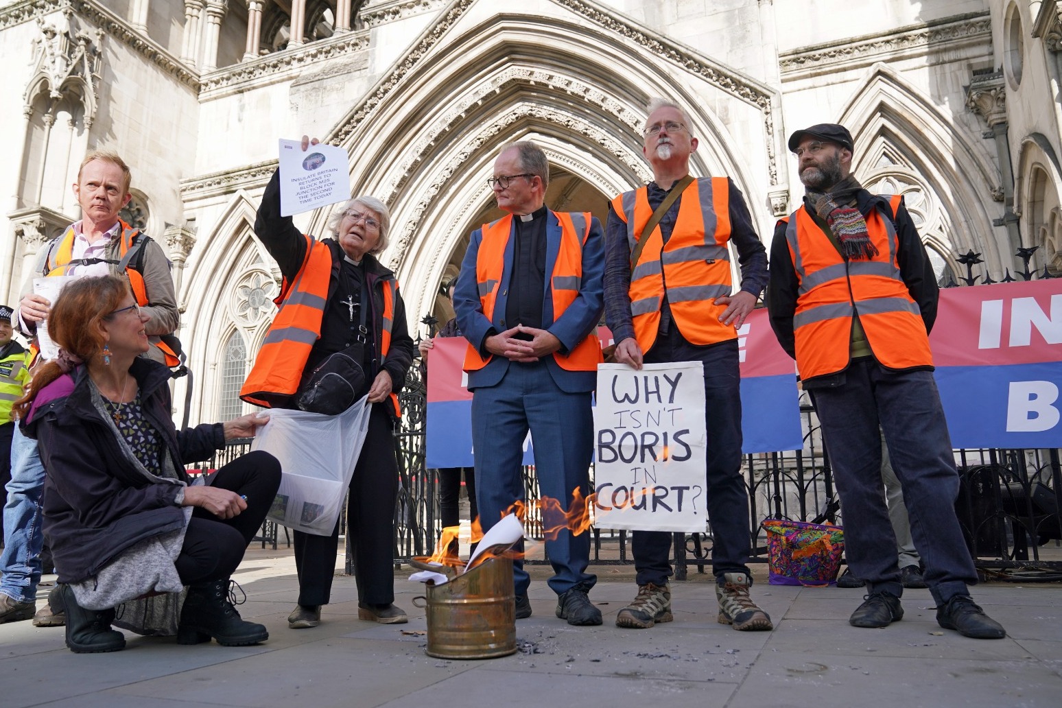 Insulate Britain protesters burn injunctions outside court as ban extended 