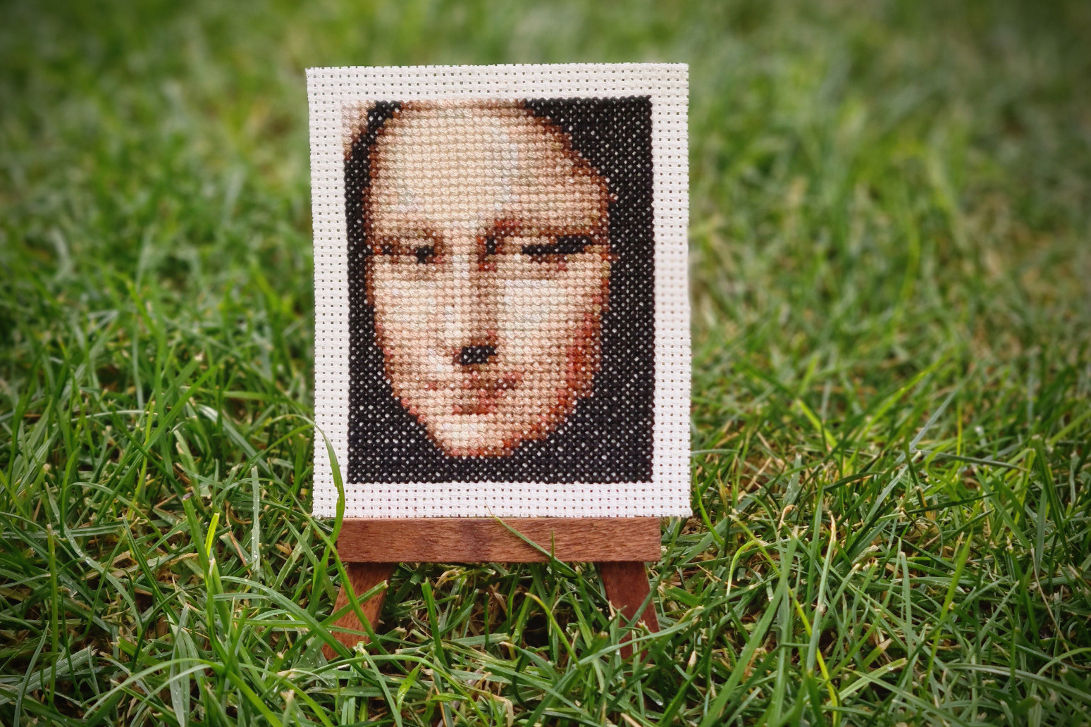 Cross-stitcher sews mini-gallery of famous masterpieces 