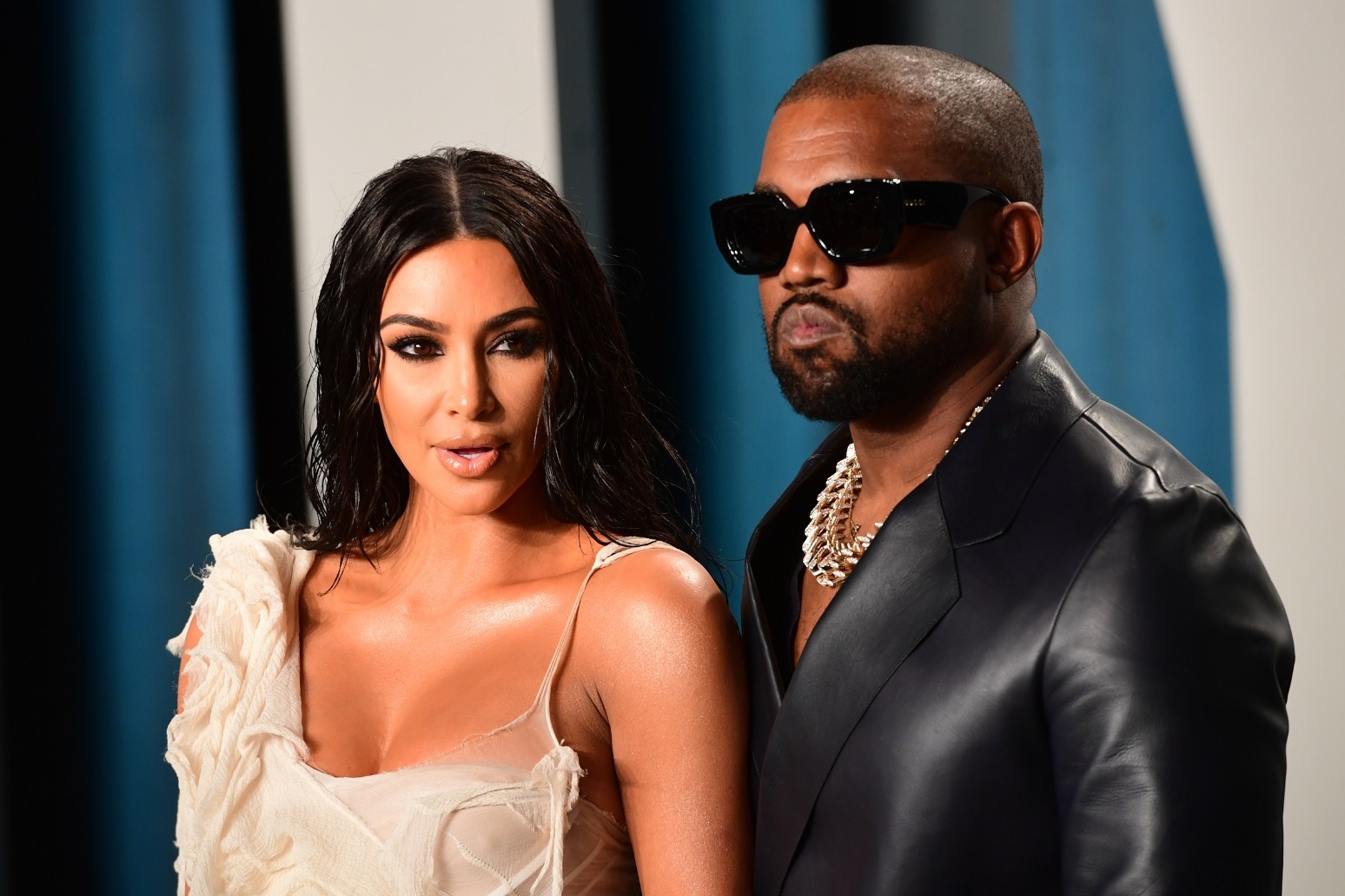 Kanye West apologises for online attacks and use of all capital letters 