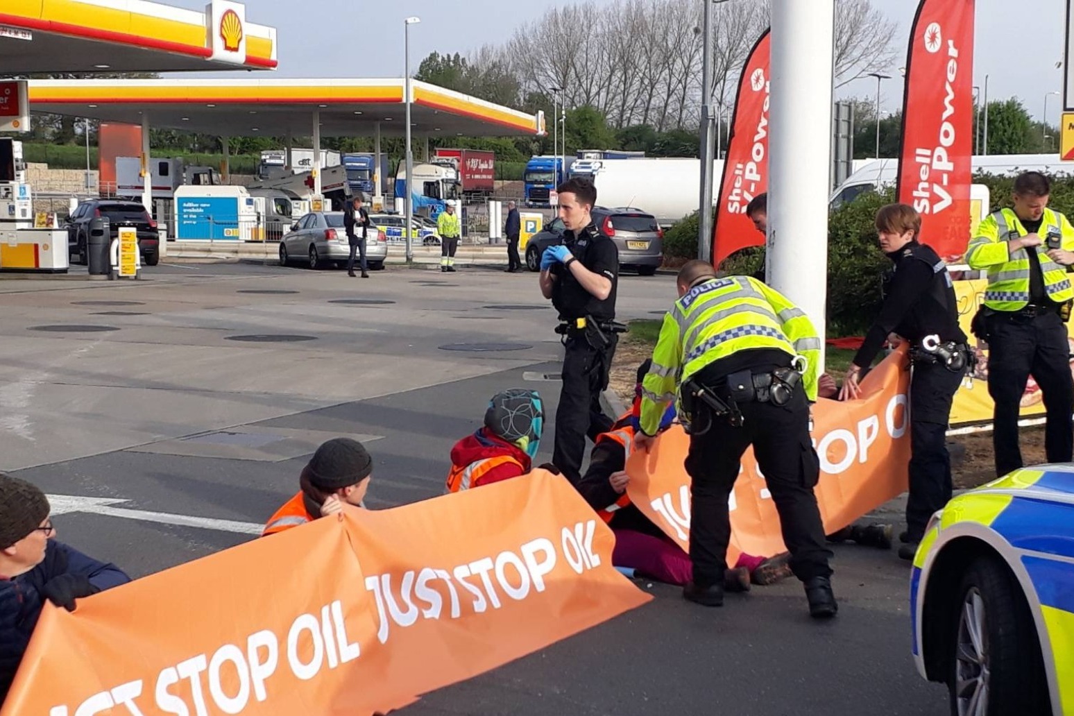 Climate protesters smash petrol pumps at motorway services 