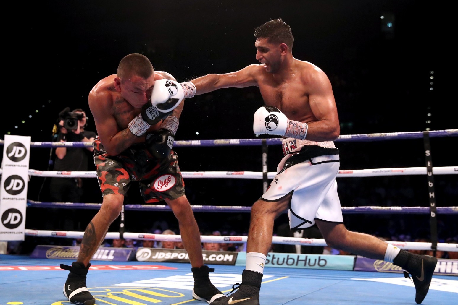 Three arrested after boxer Amir Khan robbed at gunpoint 