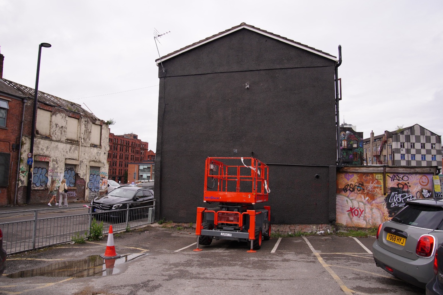 Aitch vows to ‘fix’ situation after Ian Curtis mural covered with album advert 