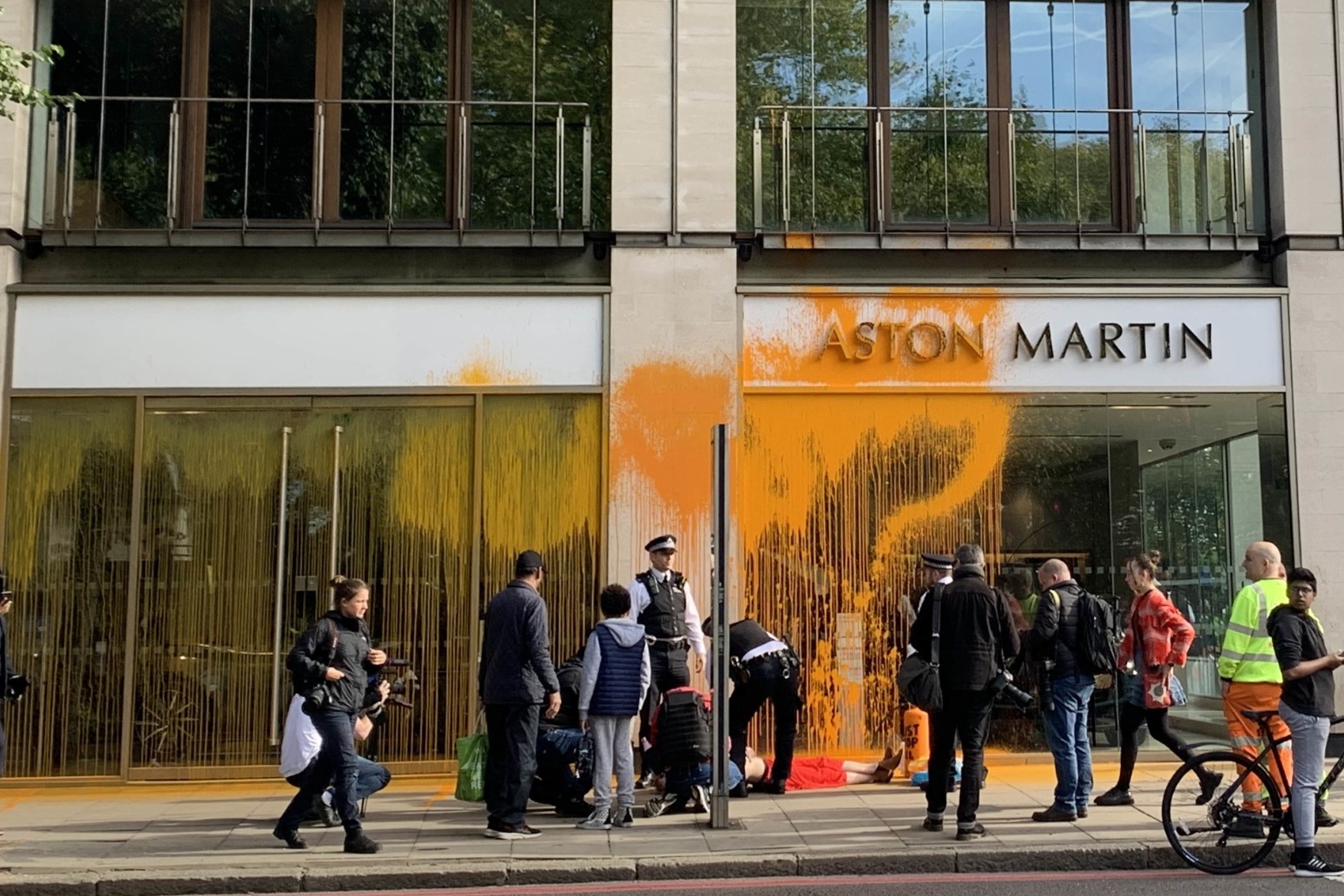 Just Stop Oil supporters spray paint over Aston Martin showroom in London 