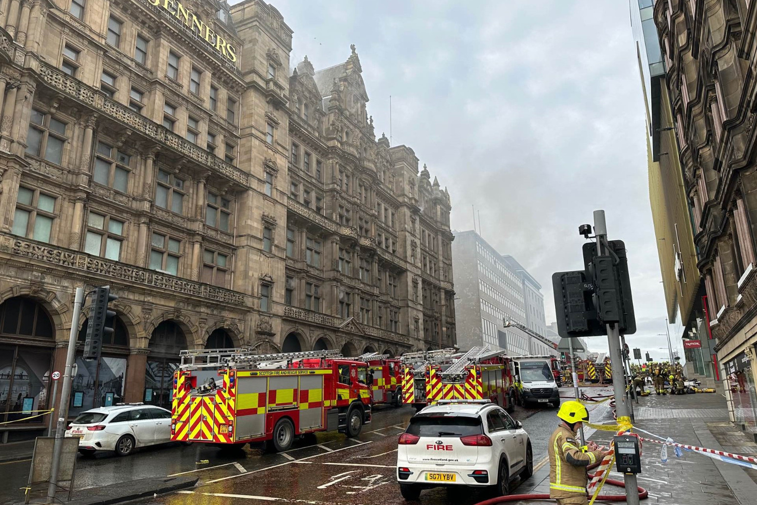Firefighter in critical condition after blaze at former department store 