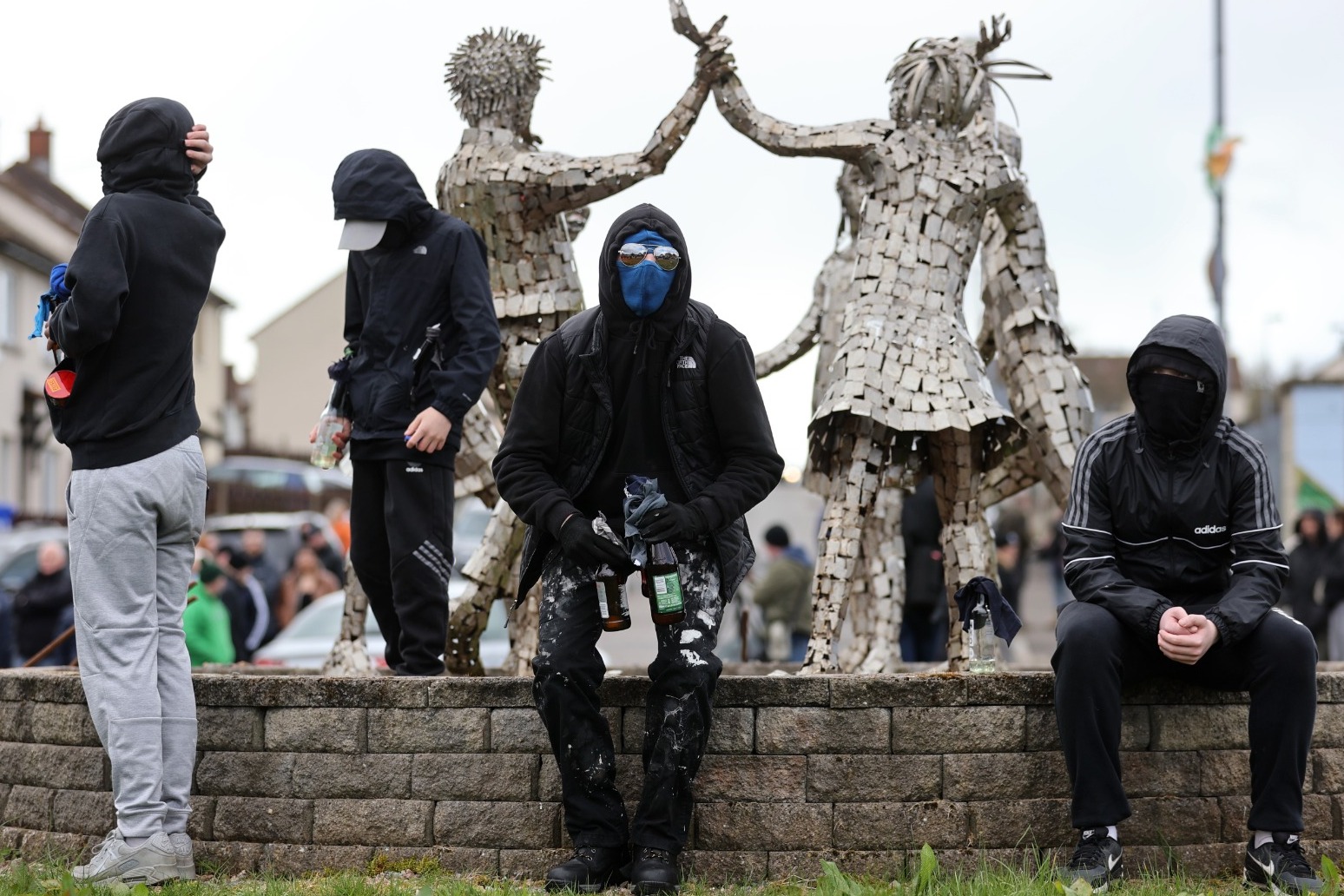 Appeal for calm as police attacked with petrol bombs at dissident march 