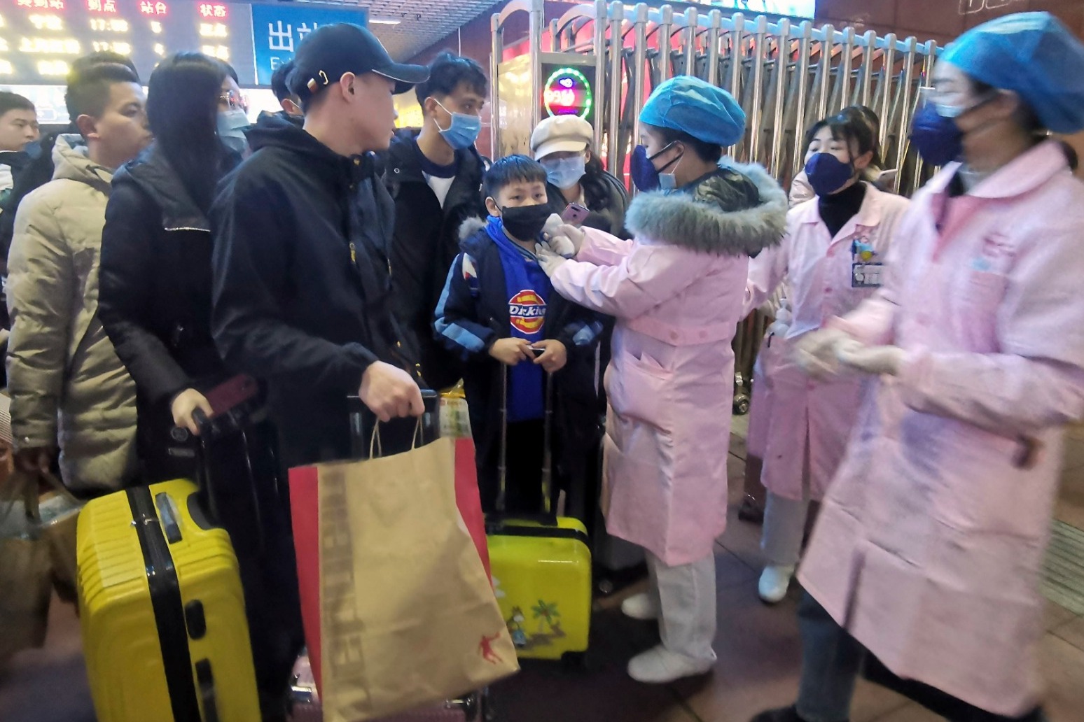 Chinese city stops outbound flights and trains in bid to contain virus 
