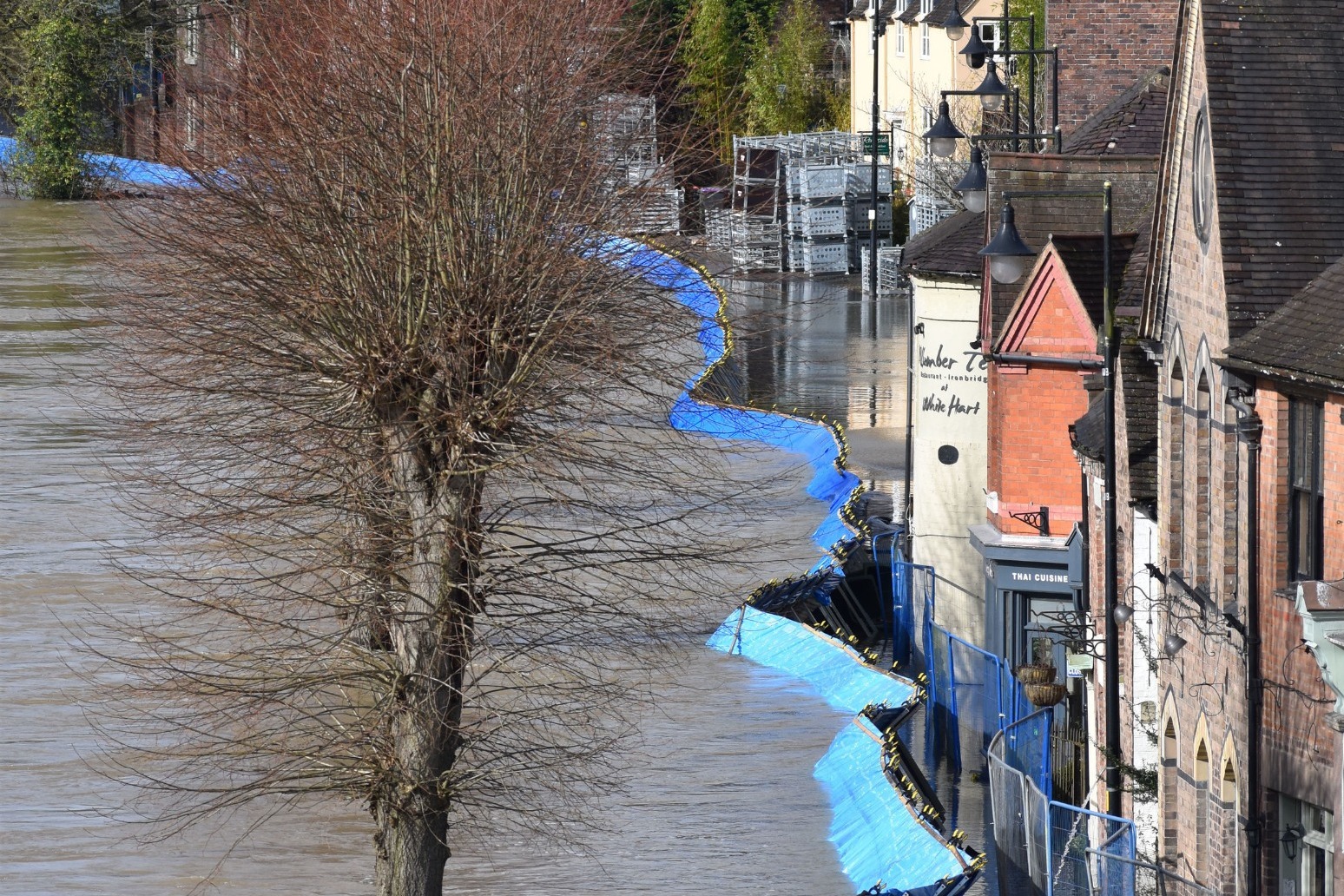 Ironbridge residents urged to leave homes as flood barriers overwhelmed 