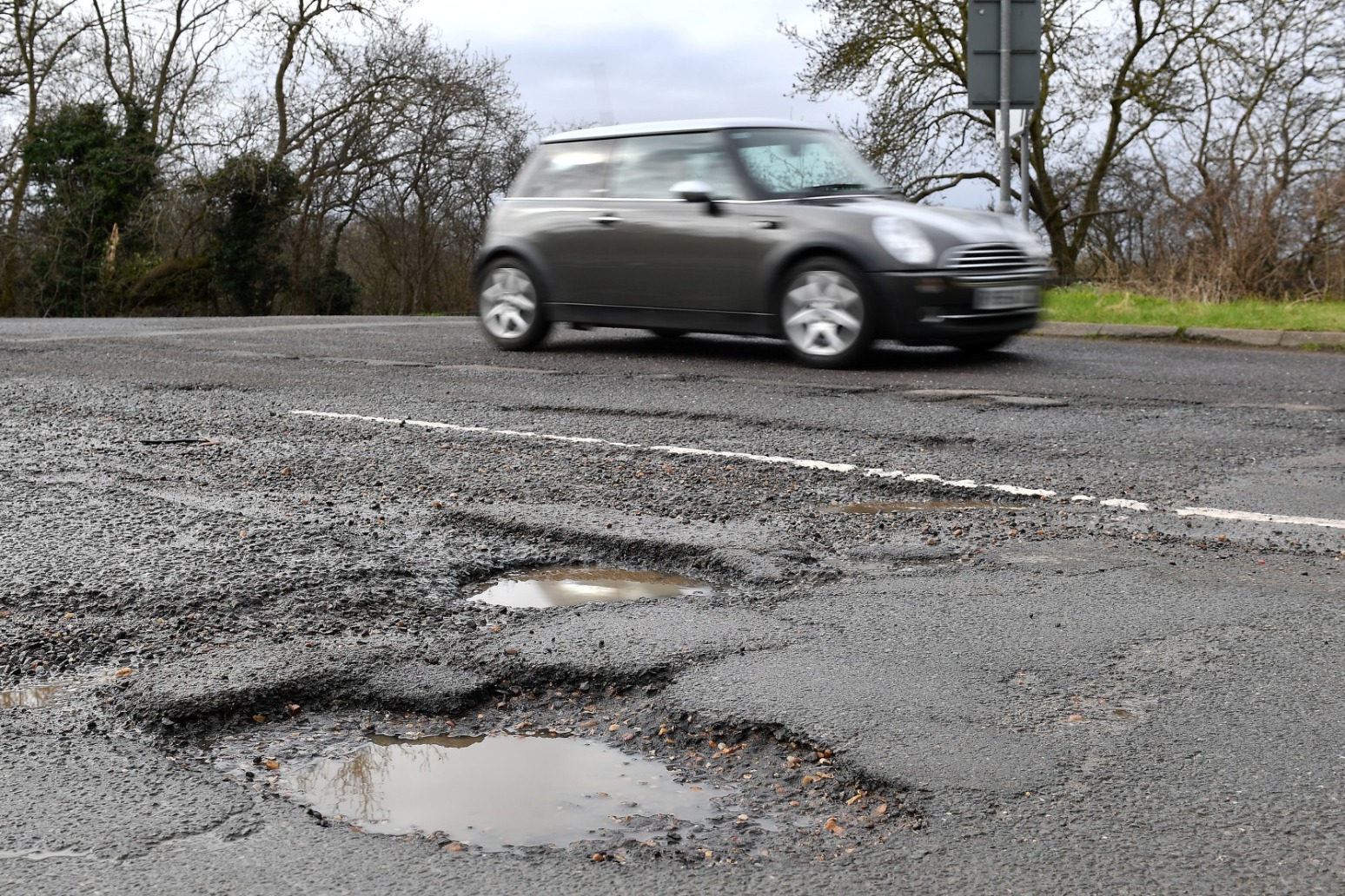 Councils say extra cars causing potholes 