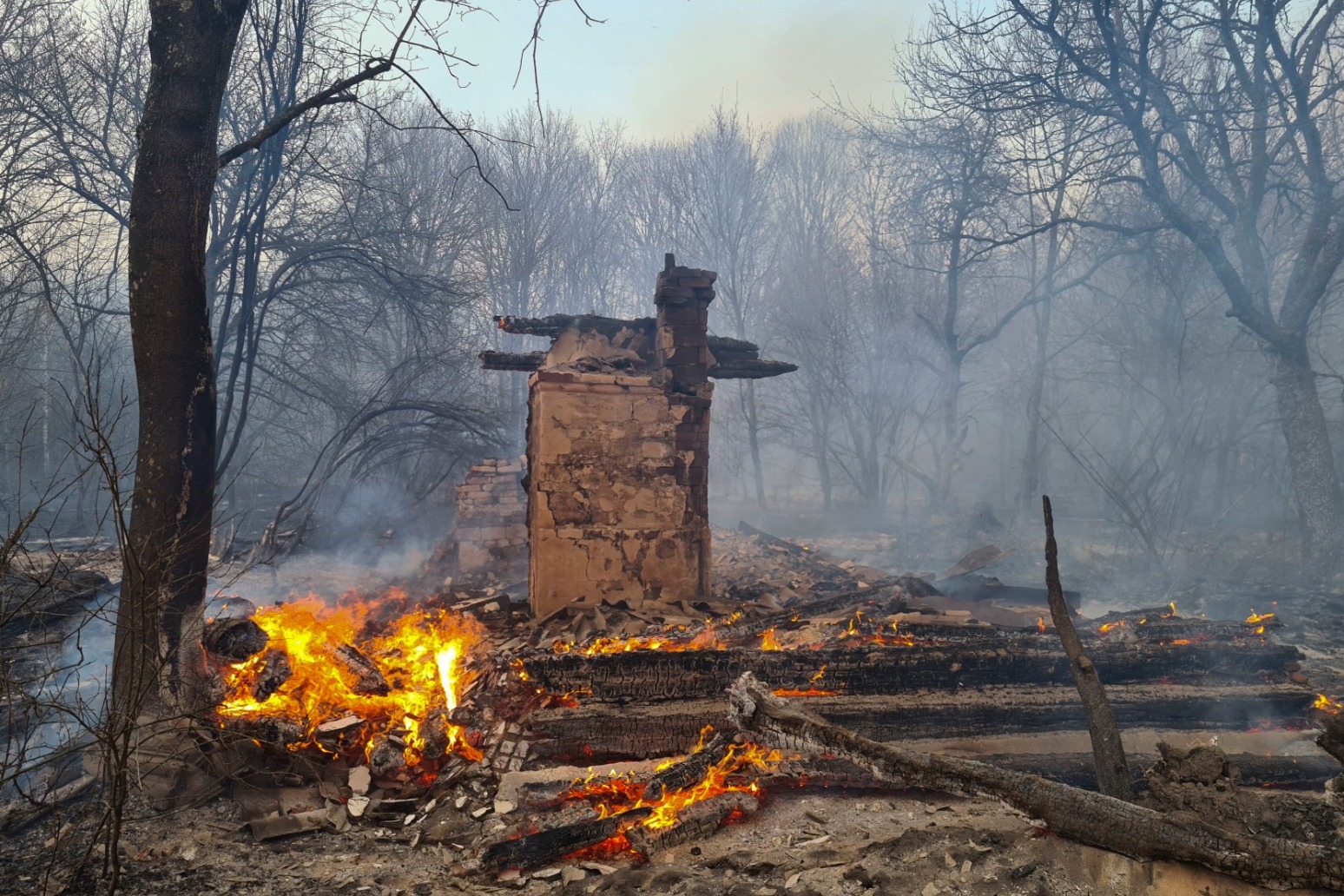 Firefighters work to contain forest fires near Chernobyl nuclear site 